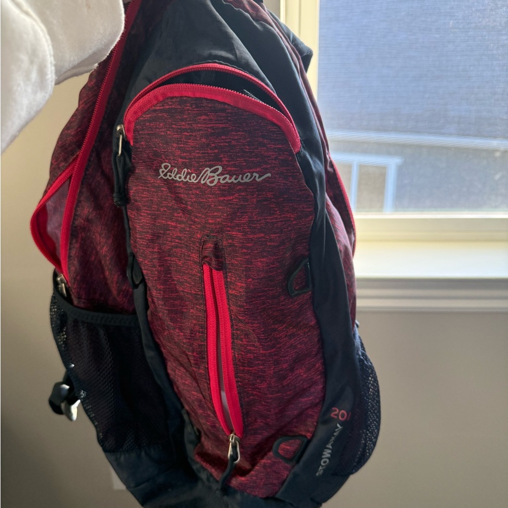 Eddie Bauer backpack with lots of pockets and folds into itself to make a ball